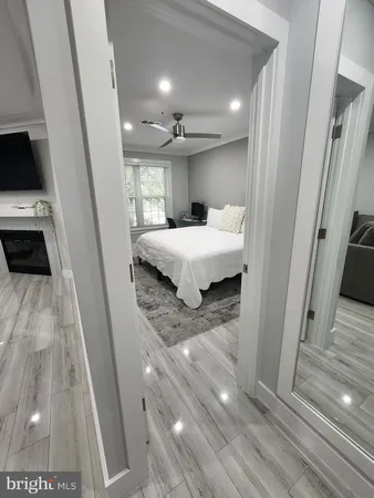 a bathroom with a sink a toilet a tub and view
