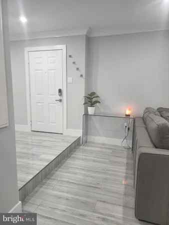 a view of a livingroom with wooden floor