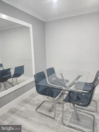 a living room with chairs and a table