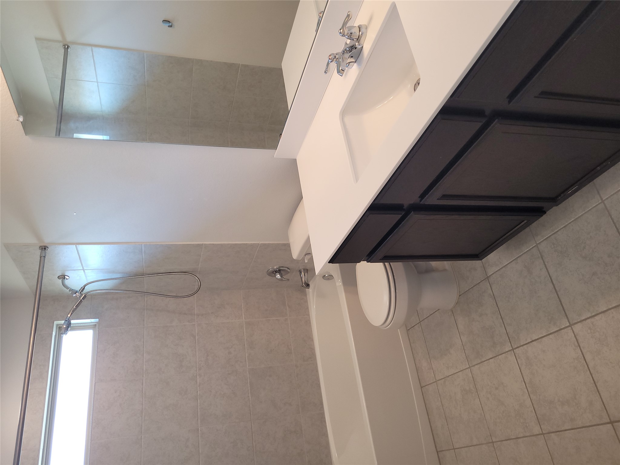 8308 Daisy Cutter Crossing Georgetown, TX 78626 - Photo 10 of 27 A well-appointed bathroom with a spacious vanity, large mirror, and tiled shower.
