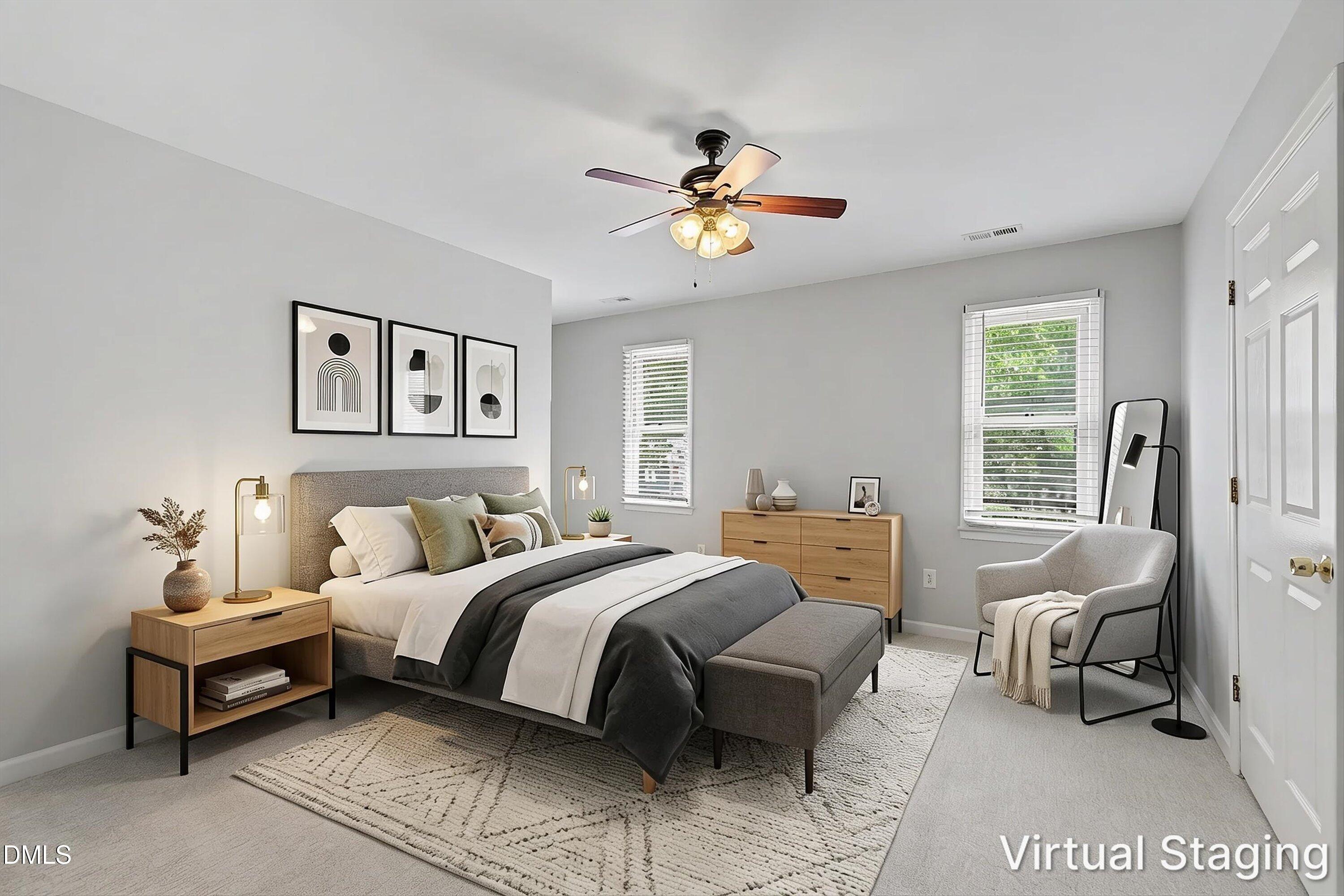 5519 Hamstead Crossing Raleigh, NC 27612 - Photo 20 of 33 a bedroom with a bed and a chandelier