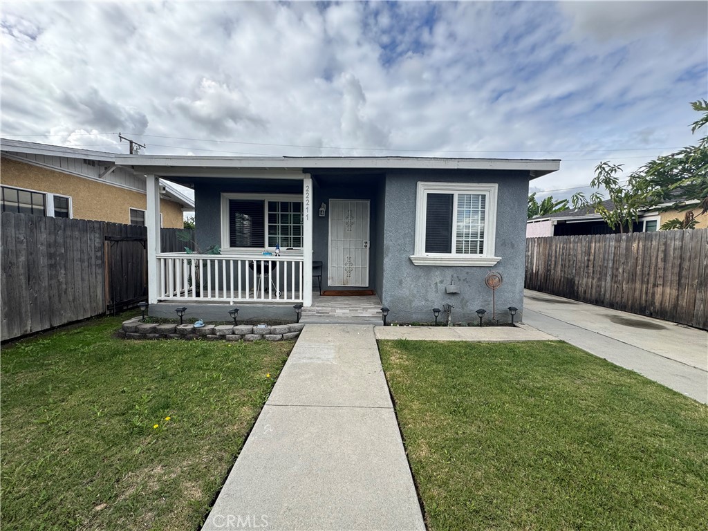 22211 Joliet Avenue Hawaiian Gardens, CA 90716 - Photo 2 of 14 a front view of a house with garden