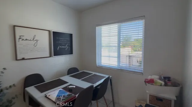 a room that has a table and a chair in it