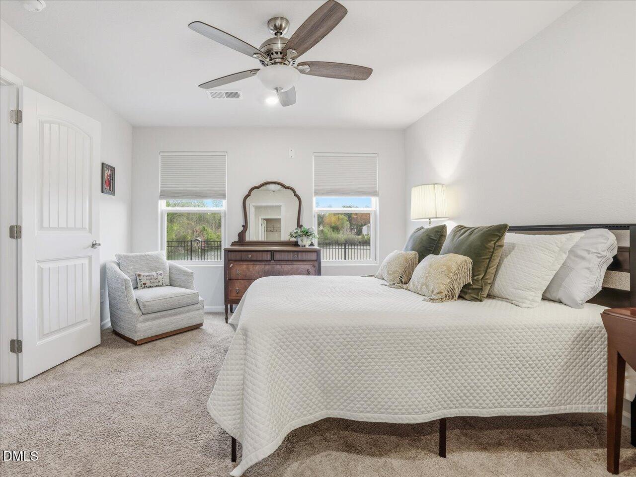 90 Barnsley Road Angier, NC 27501 - Photo 20 of 40 a bedroom with a bed and a large window