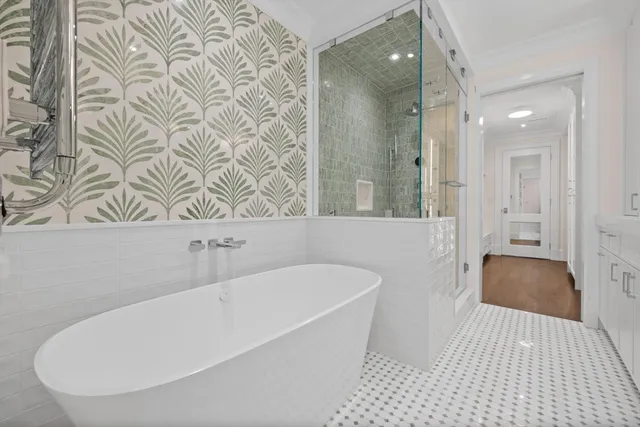 a bathroom with a bathtub and shower