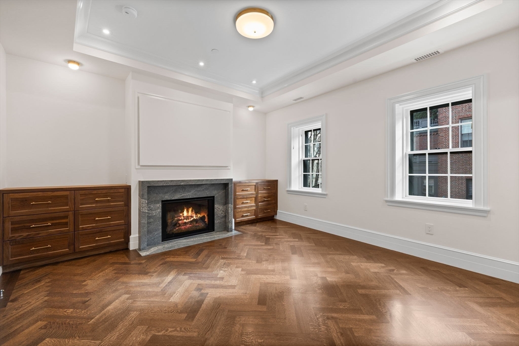 2 Byron Street Boston, MA 02108 - Photo 15 of 30 an empty room with windows and fireplace