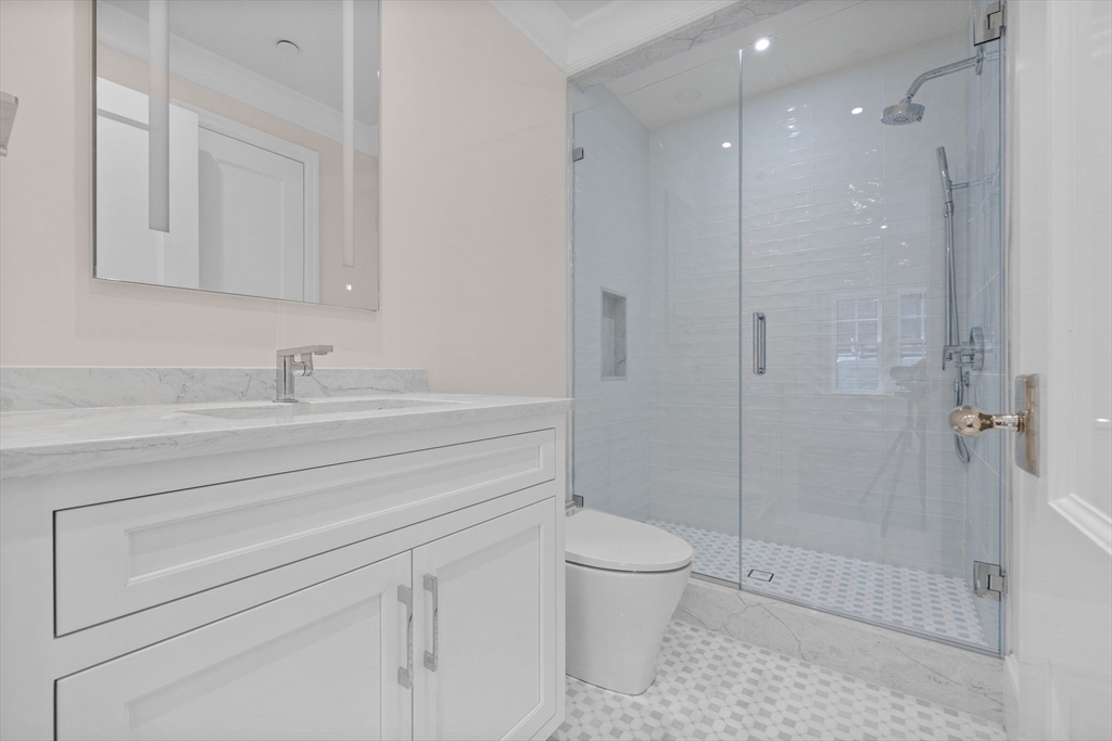 2 Byron Street Boston, MA 02108 - Photo 22 of 30 a bathroom with a shower a toilet and sink