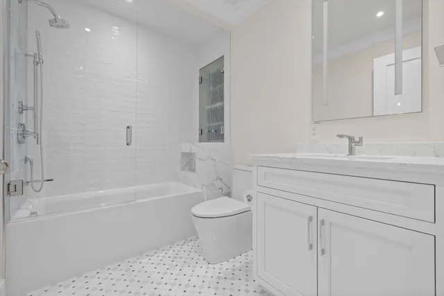 a bathroom with a sink a toilet and a bathtub