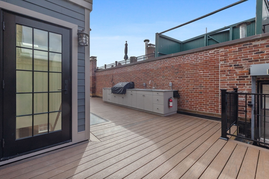 2 Byron Street Boston, MA 02108 - Photo 28 of 30 a view of a deck with wooden floor and seating space
