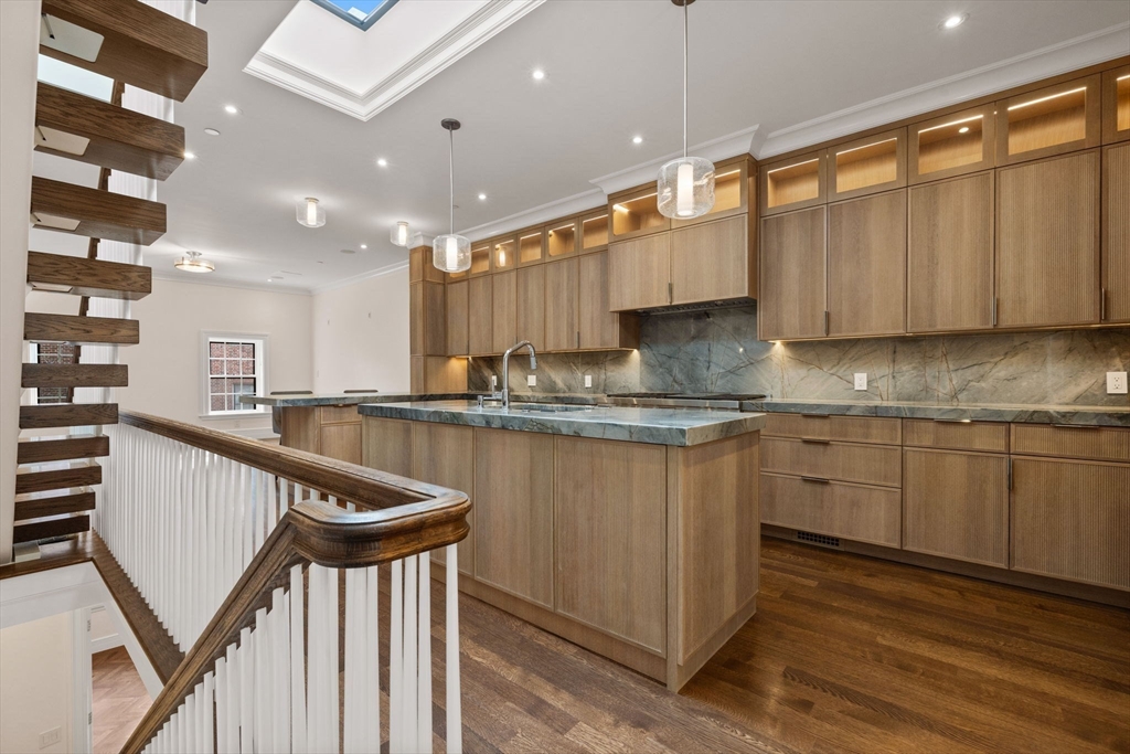 2 Byron Street Boston, MA 02108 - Photo 3 of 30 a kitchen with sink a microwave and cabinets