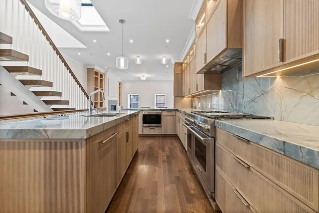 a kitchen with stainless steel appliances granite countertop lots of counter top space and cabinets