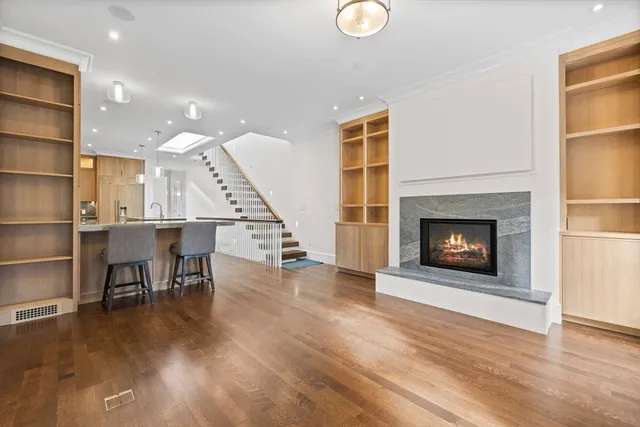 a view of a livingroom with furniture and a fireplace