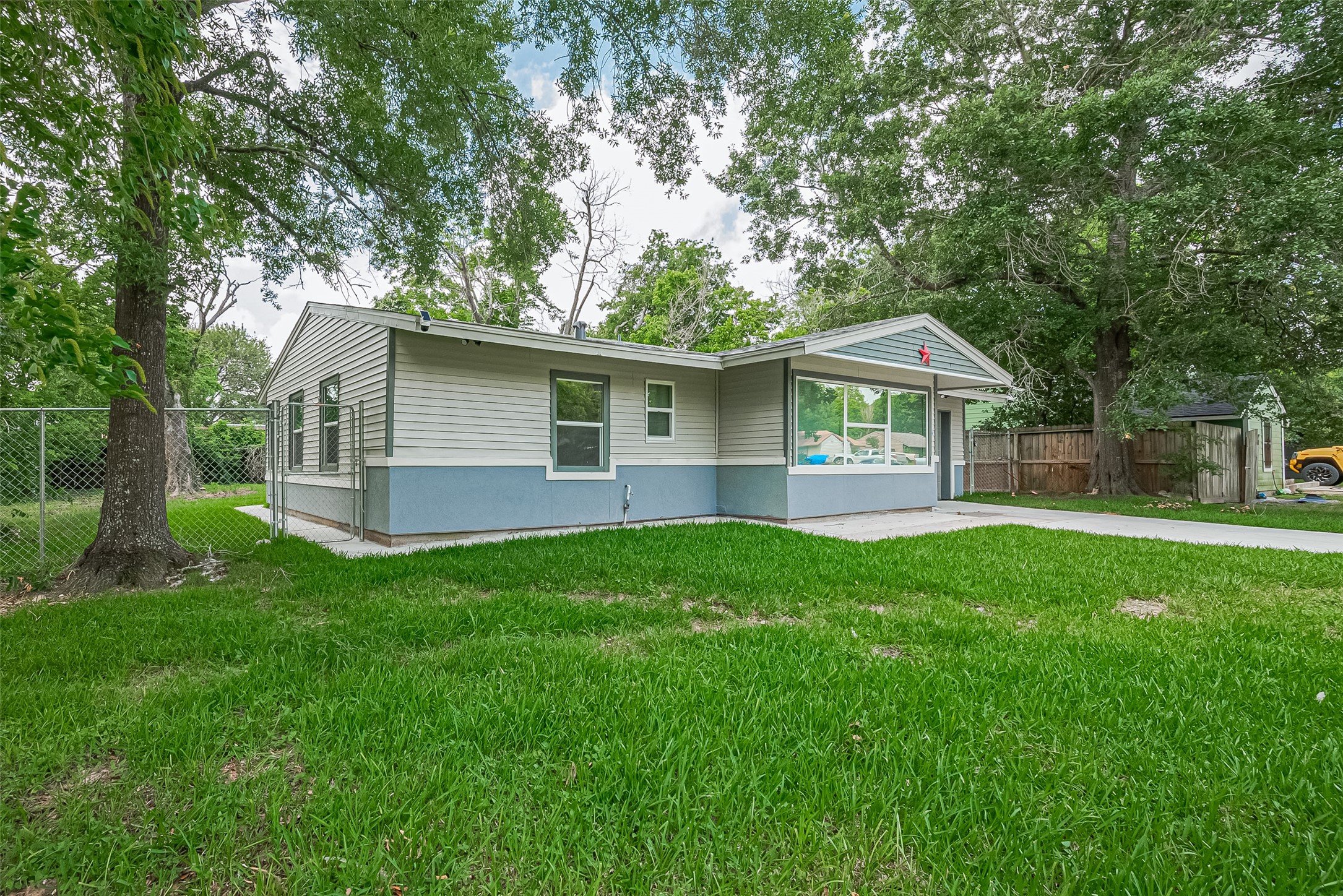 a front view of house with yard and green space