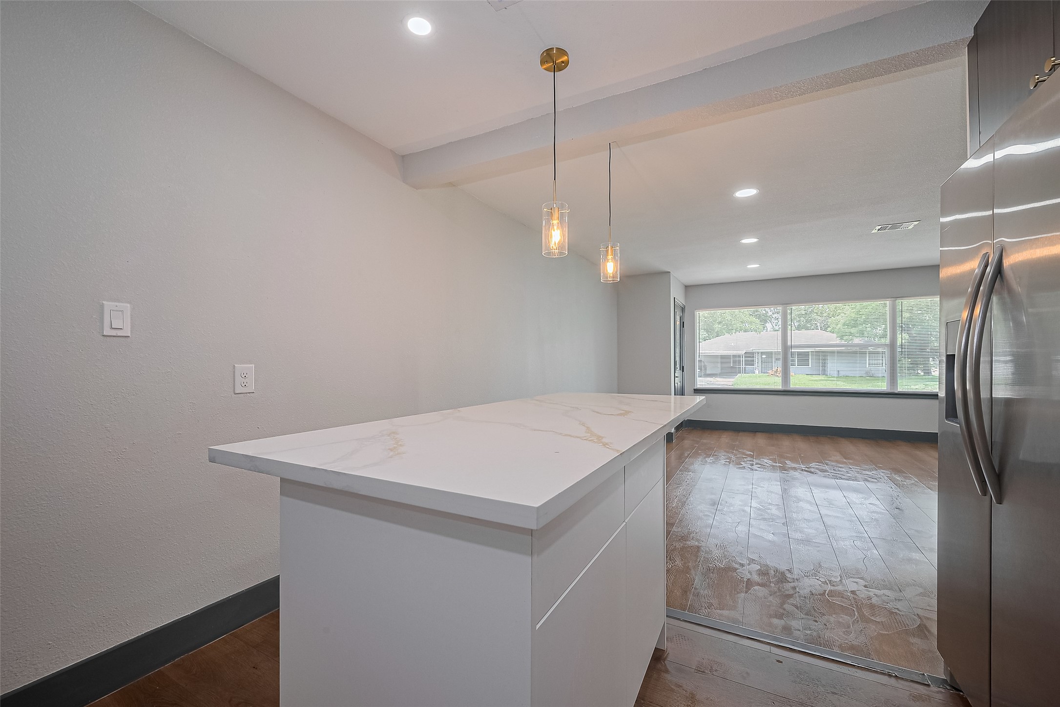 6058 Lyndhurst Drive Houston, TX 77033 - Photo 17 of 50 a view of an empty room with window and cabinet