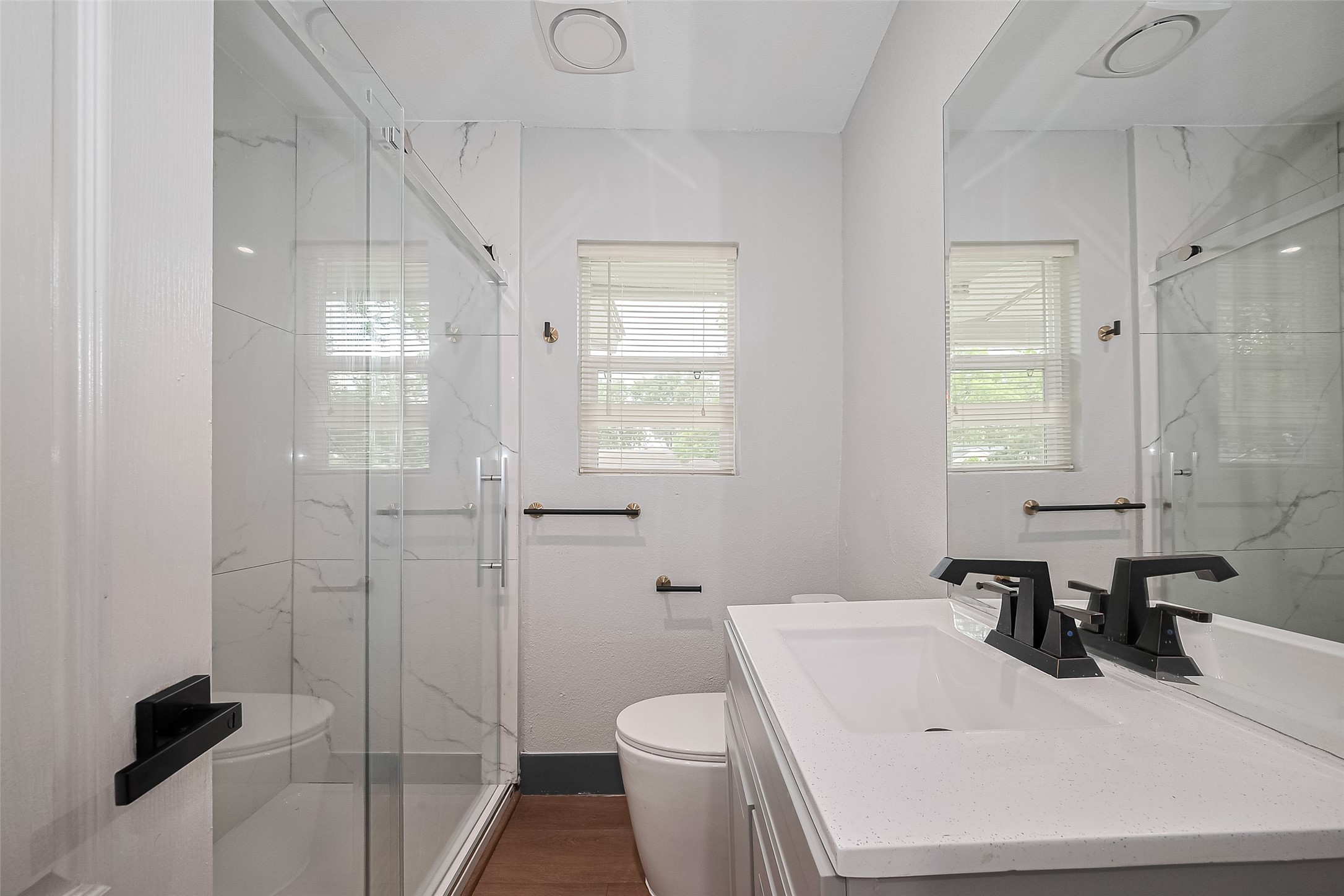 6058 Lyndhurst Drive Houston, TX 77033 - Photo 35 of 50 a bathroom with a sink toilet and shower