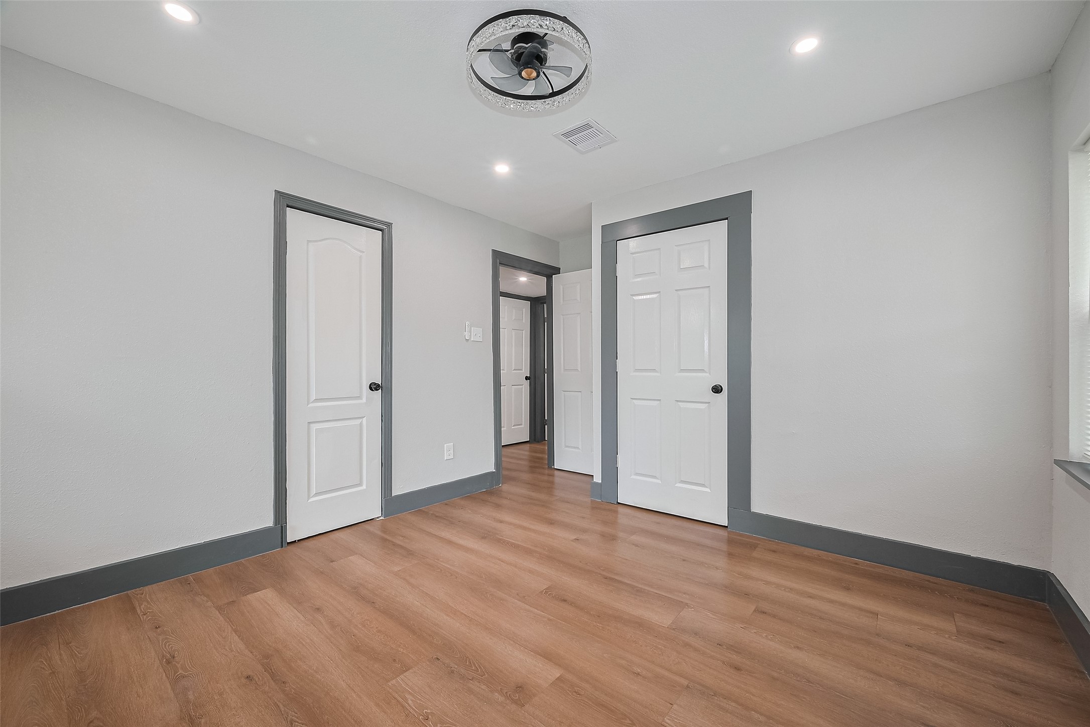 6058 Lyndhurst Drive Houston, TX 77033 - Photo 40 of 50 a view of empty room with wooden floor