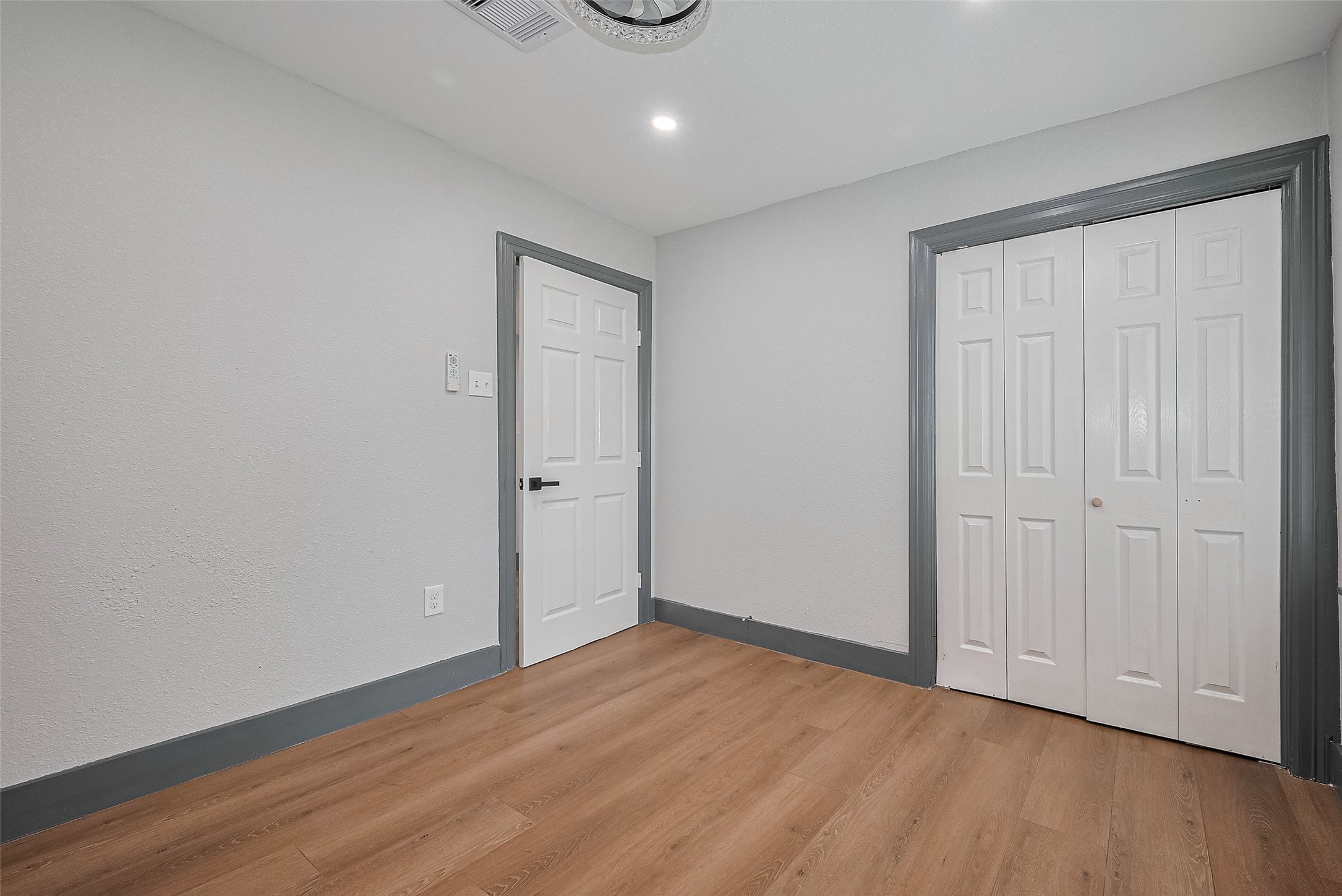 6058 Lyndhurst Drive Houston, TX 77033 - Photo 45 of 50 a view of an empty room with wooden floor