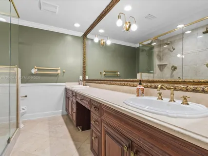 a bathroom with a shower and a sink