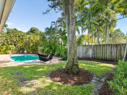 an aerial view of a house with a garden