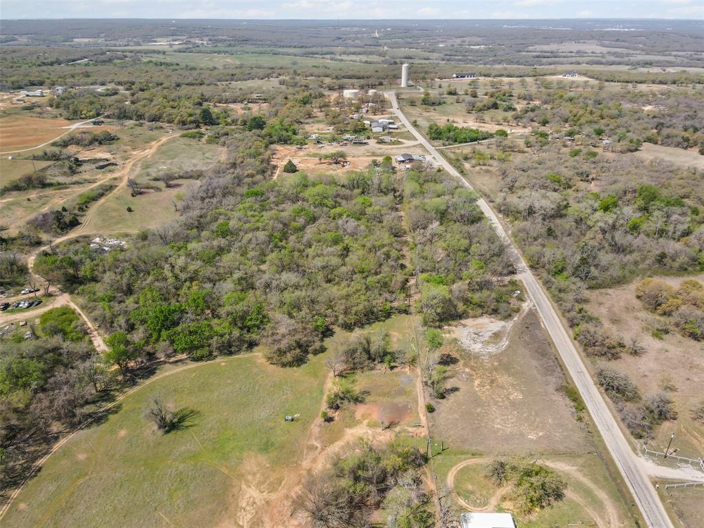 4 County Road 3855 Poolville, TX 76487 - Photo 11 of 13 an aerial view of residential houses with outdoor space
