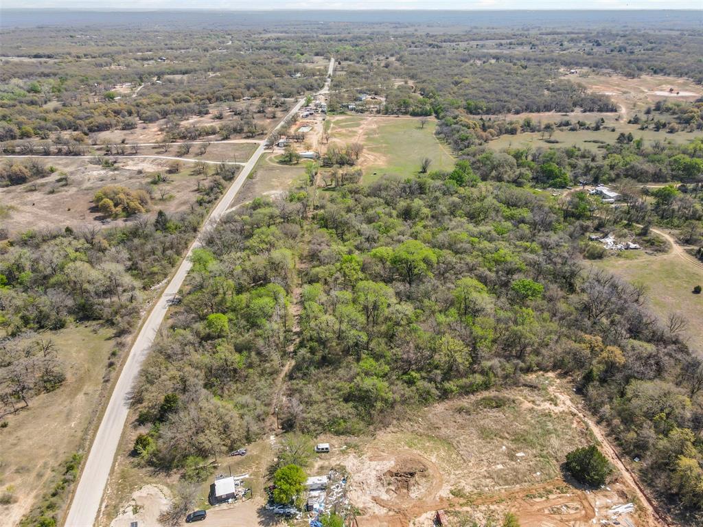 4 County Road 3855 Poolville, TX 76487 - Photo 5 of 13 an aerial view of residential houses with outdoor space