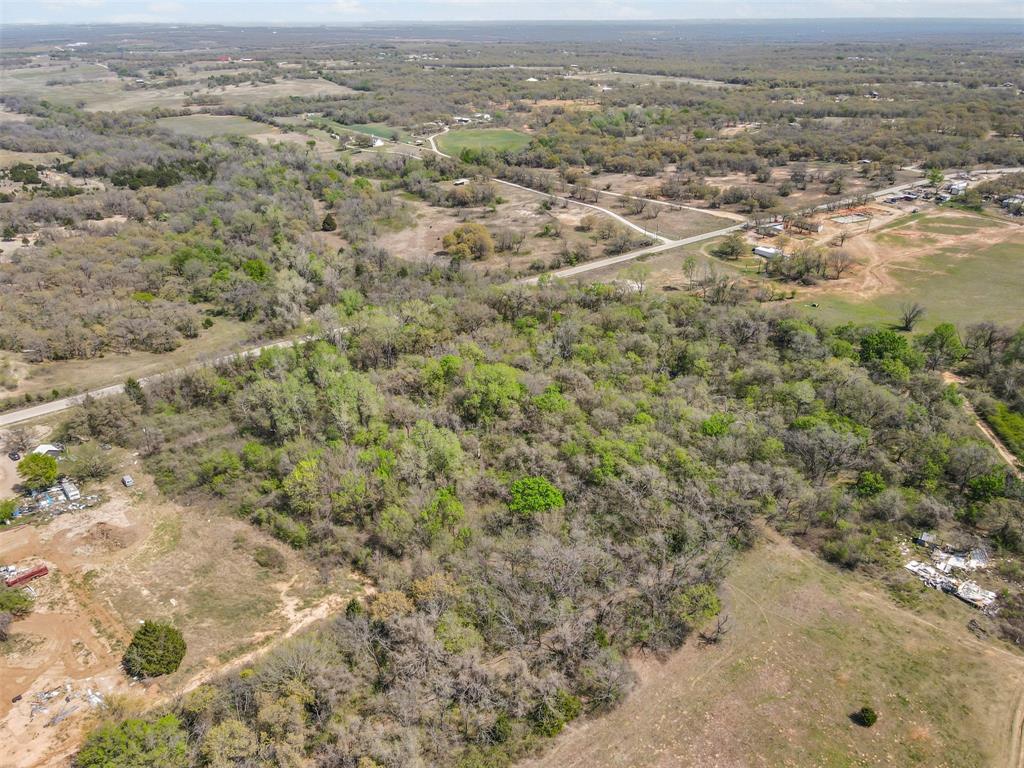 4 County Road 3855 Poolville, TX 76487 - Photo 7 of 13 an aerial view of residential houses with outdoor space