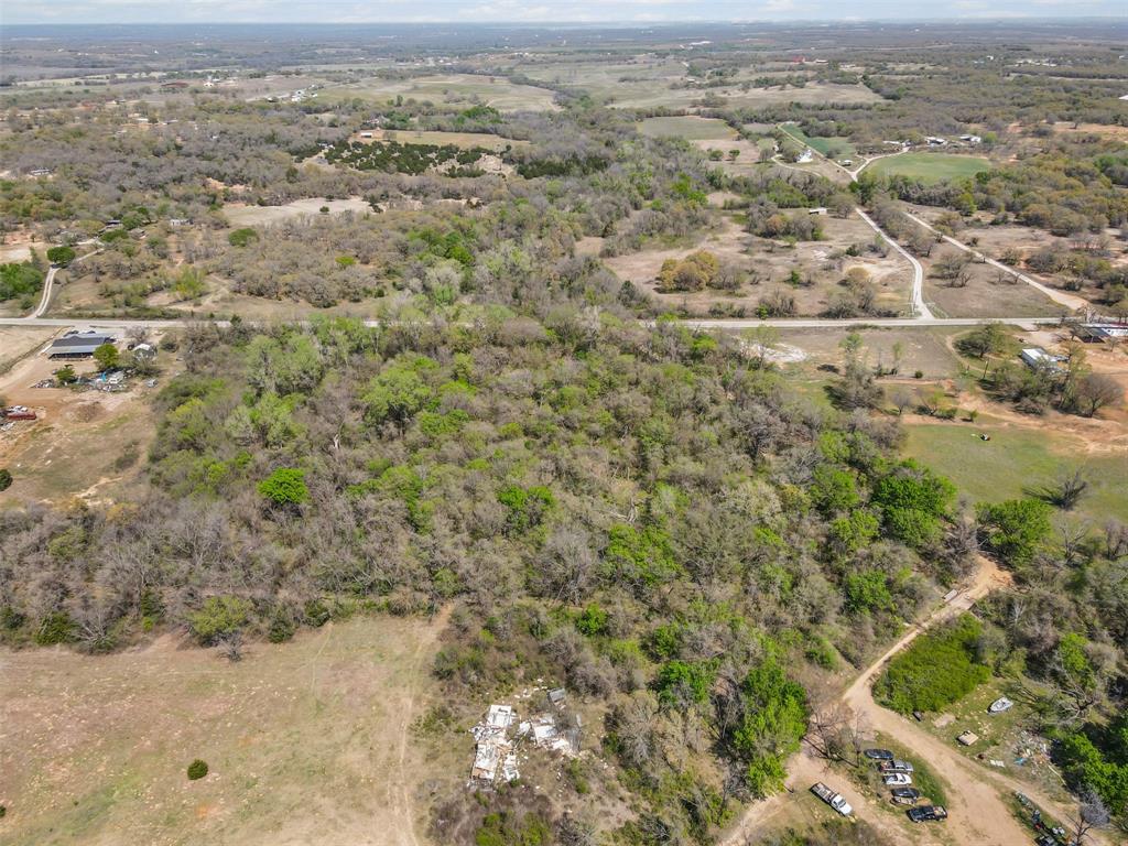 4 County Road 3855 Poolville, TX 76487 - Photo 8 of 13 an aerial view of residential houses with outdoor space