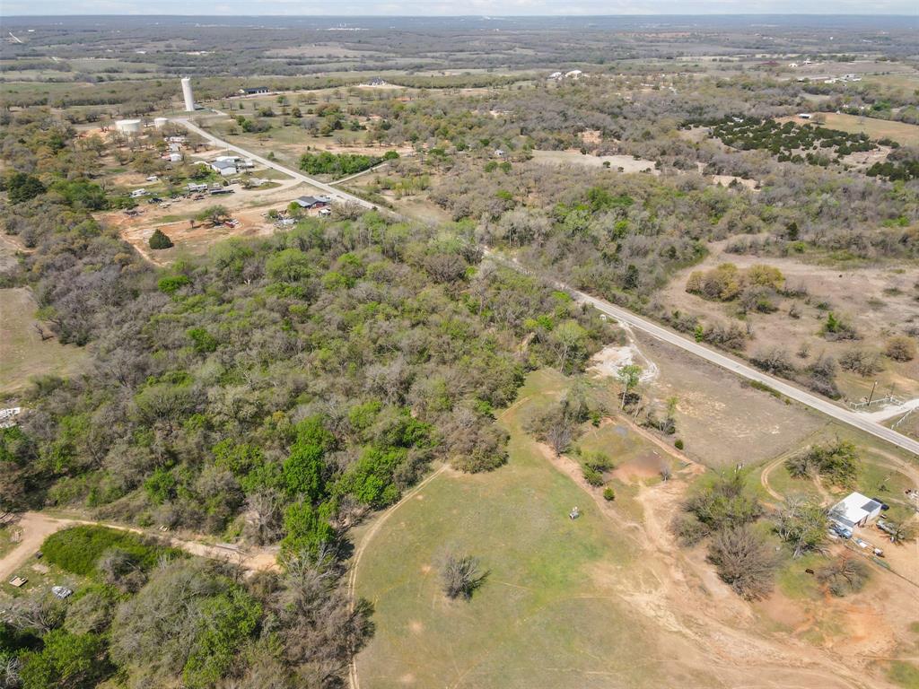 4 County Road 3855 Poolville, TX 76487 - Photo 10 of 13 an aerial view of residential houses with outdoor space