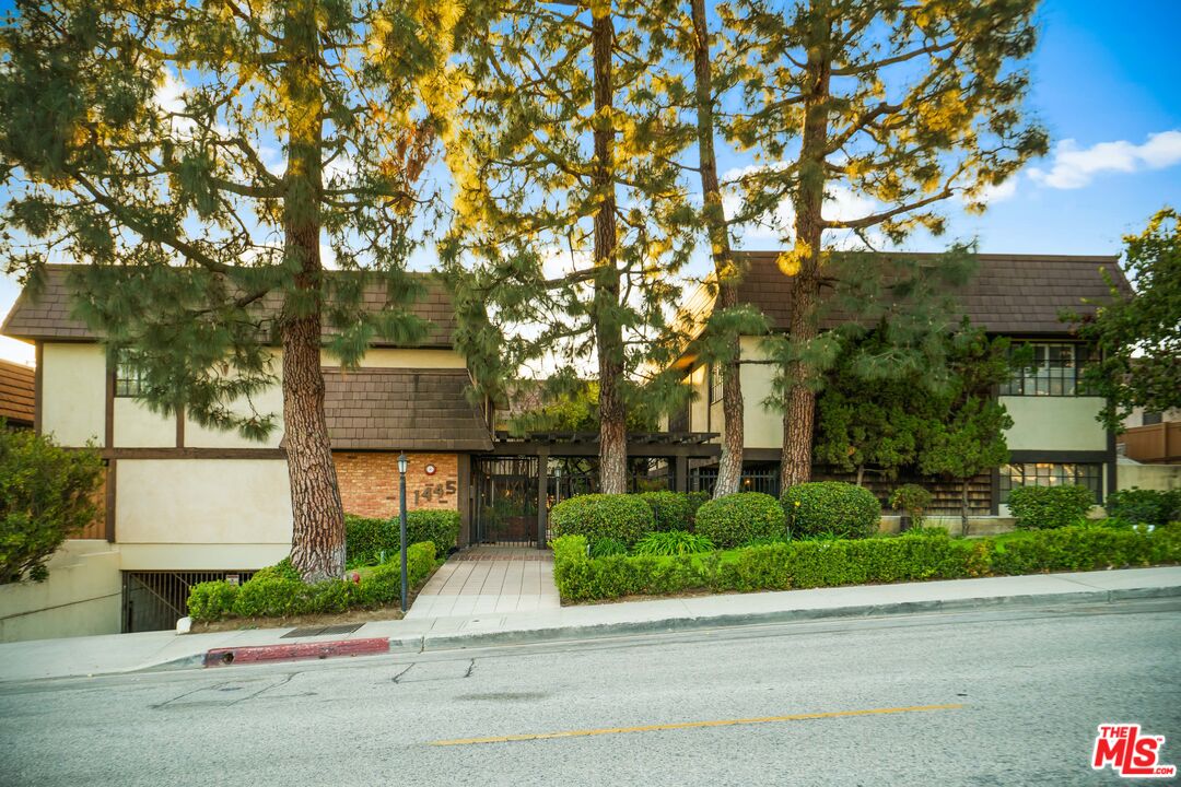 1445 Valley View Road, Unit 2 Glendale, CA 91202 - Photo 1 of 36 a front view of a house with a garden and tree