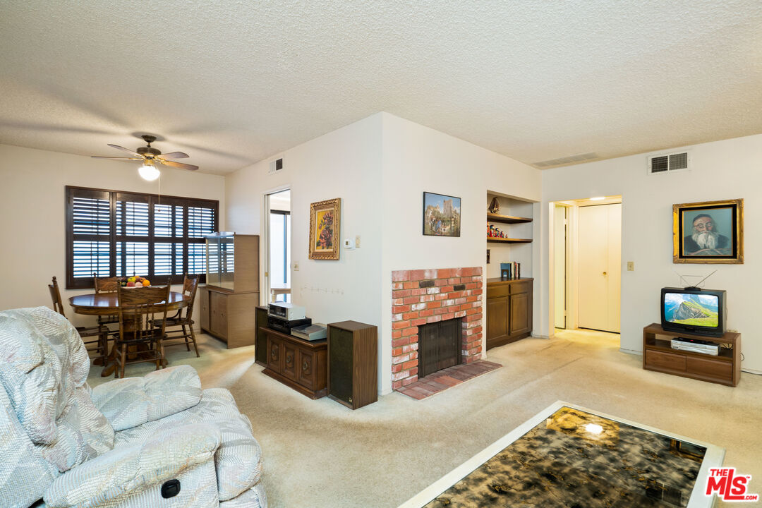 1445 Valley View Road, Unit 2 Glendale, CA 91202 - Photo 12 of 36 a living room with furniture a rug and white walls