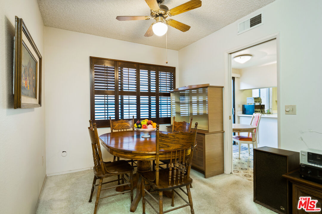 1445 Valley View Road, Unit 2 Glendale, CA 91202 - Photo 13 of 36 a view of a dining room with furniture and a chandelier