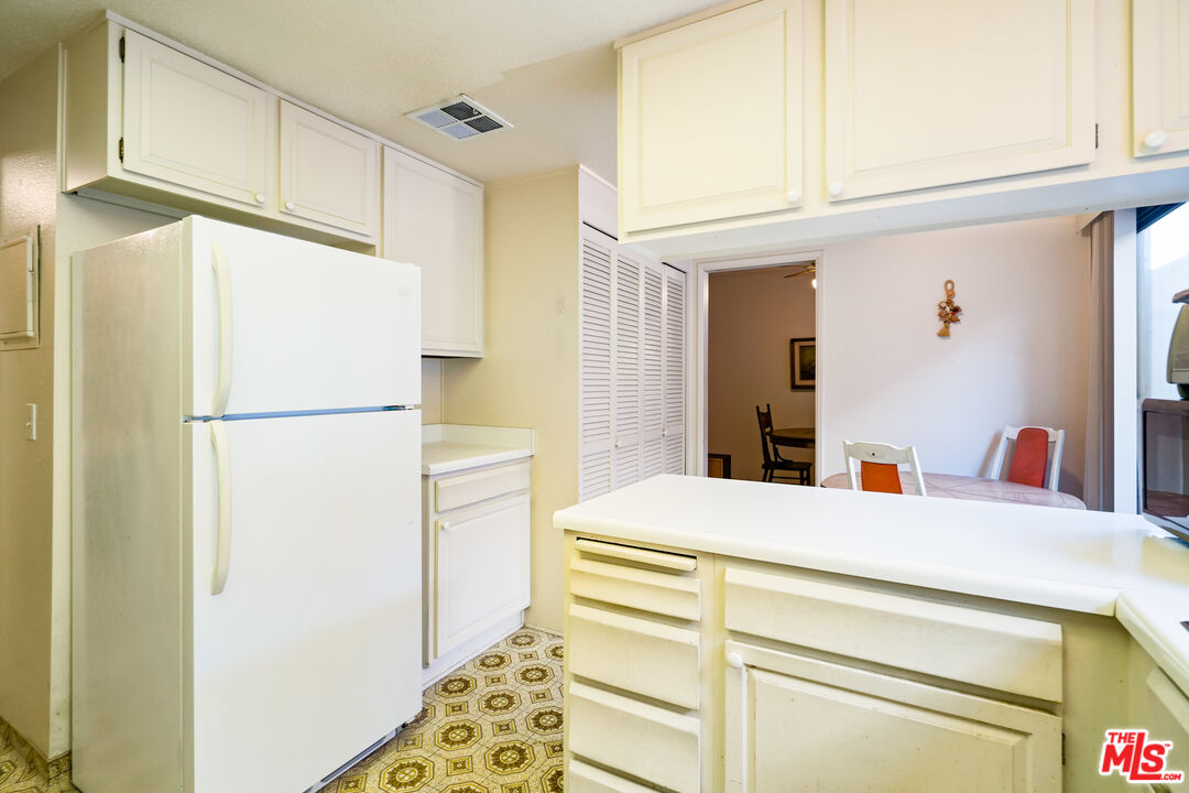 1445 Valley View Road, Unit 2 Glendale, CA 91202 - Photo 19 of 36 a bedroom with a bed and a refrigerator