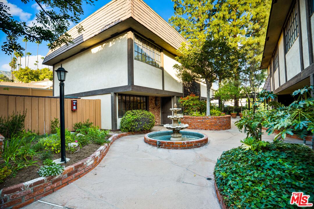 1445 Valley View Road, Unit 2 Glendale, CA 91202 - Photo 3 of 36 a front view of a house with garden and patio