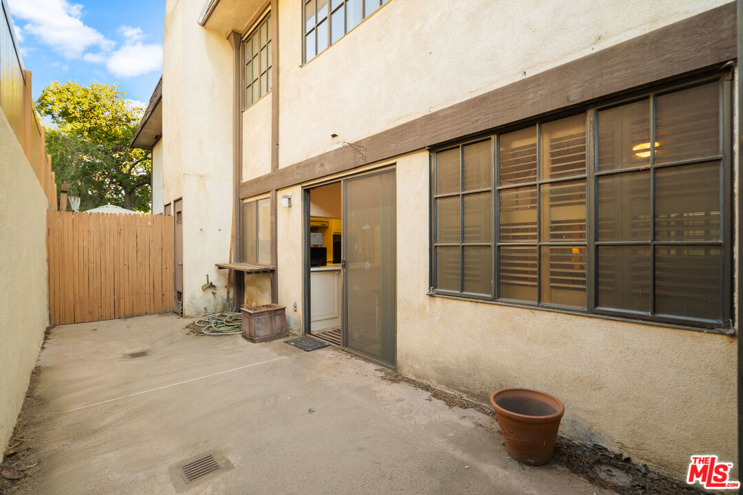 1445 Valley View Road, Unit 2 Glendale, CA 91202 - Photo 21 of 36 a view of a blue house with a bench in patio