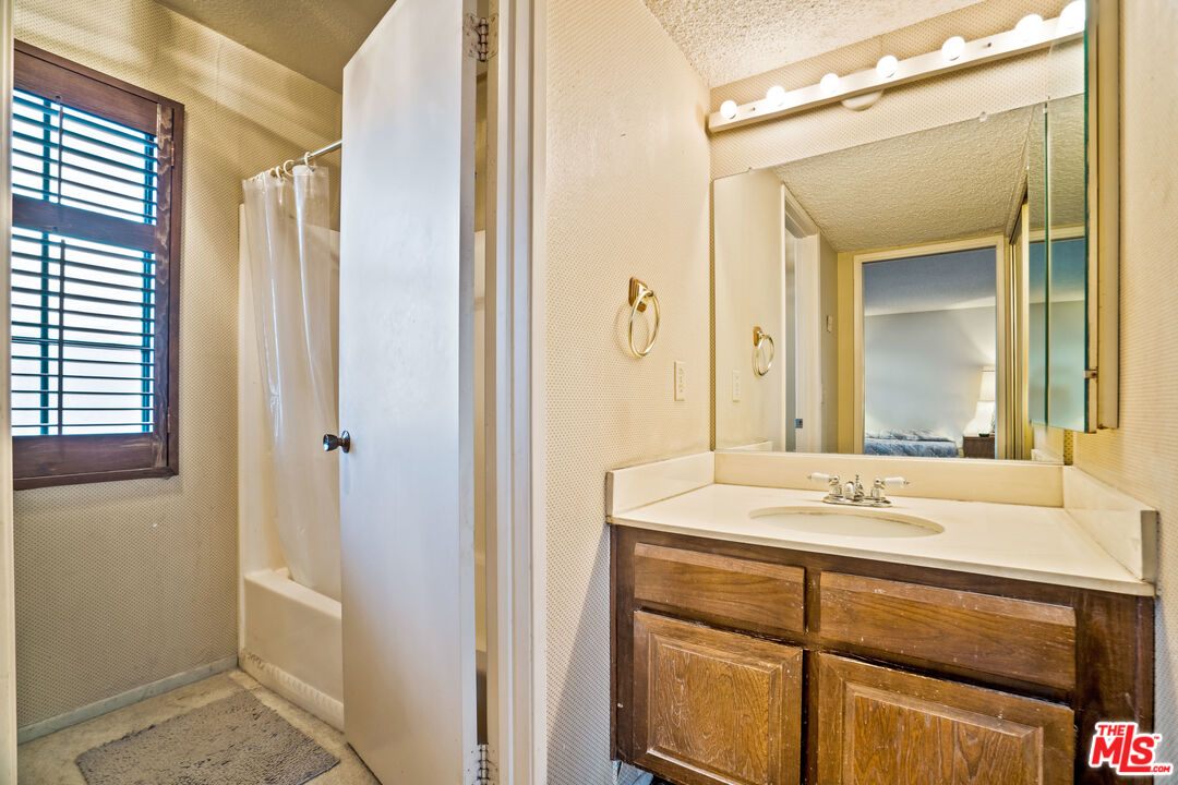 1445 Valley View Road, Unit 2 Glendale, CA 91202 - Photo 31 of 36 a bathroom with a sink and a mirror