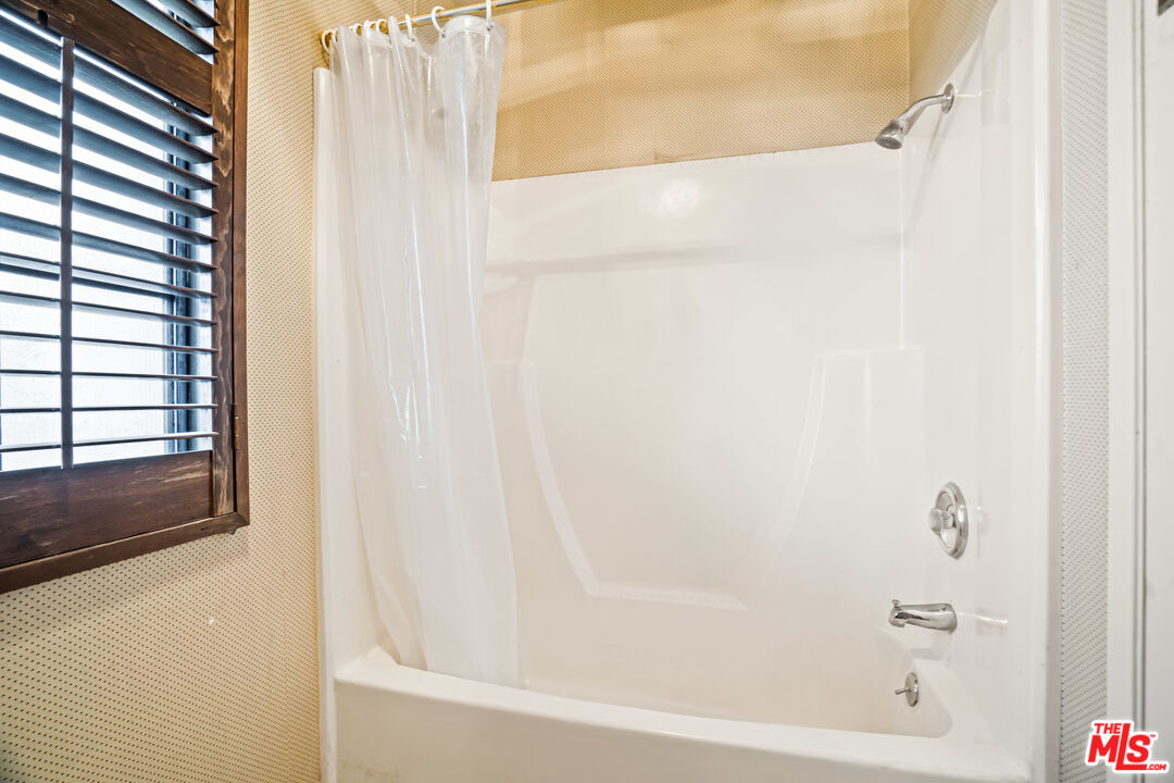 1445 Valley View Road, Unit 2 Glendale, CA 91202 - Photo 32 of 36 a close up of a bathtub curtain