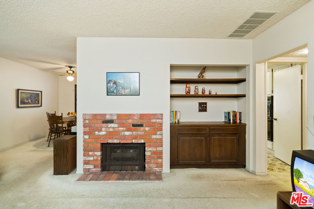 1445 Valley View Road, Unit 2 Glendale, CA 91202 - Photo 7 of 36 a room with furniture and a fireplace