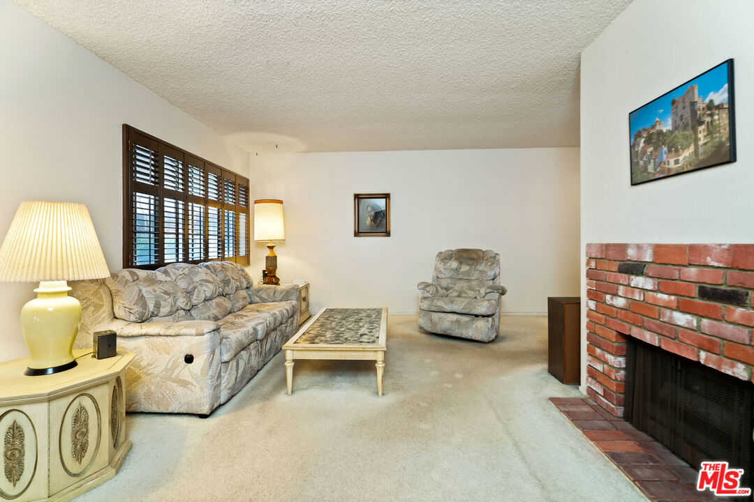 1445 Valley View Road, Unit 2 Glendale, CA 91202 - Photo 10 of 36 a bedroom with furniture and a flat screen tv