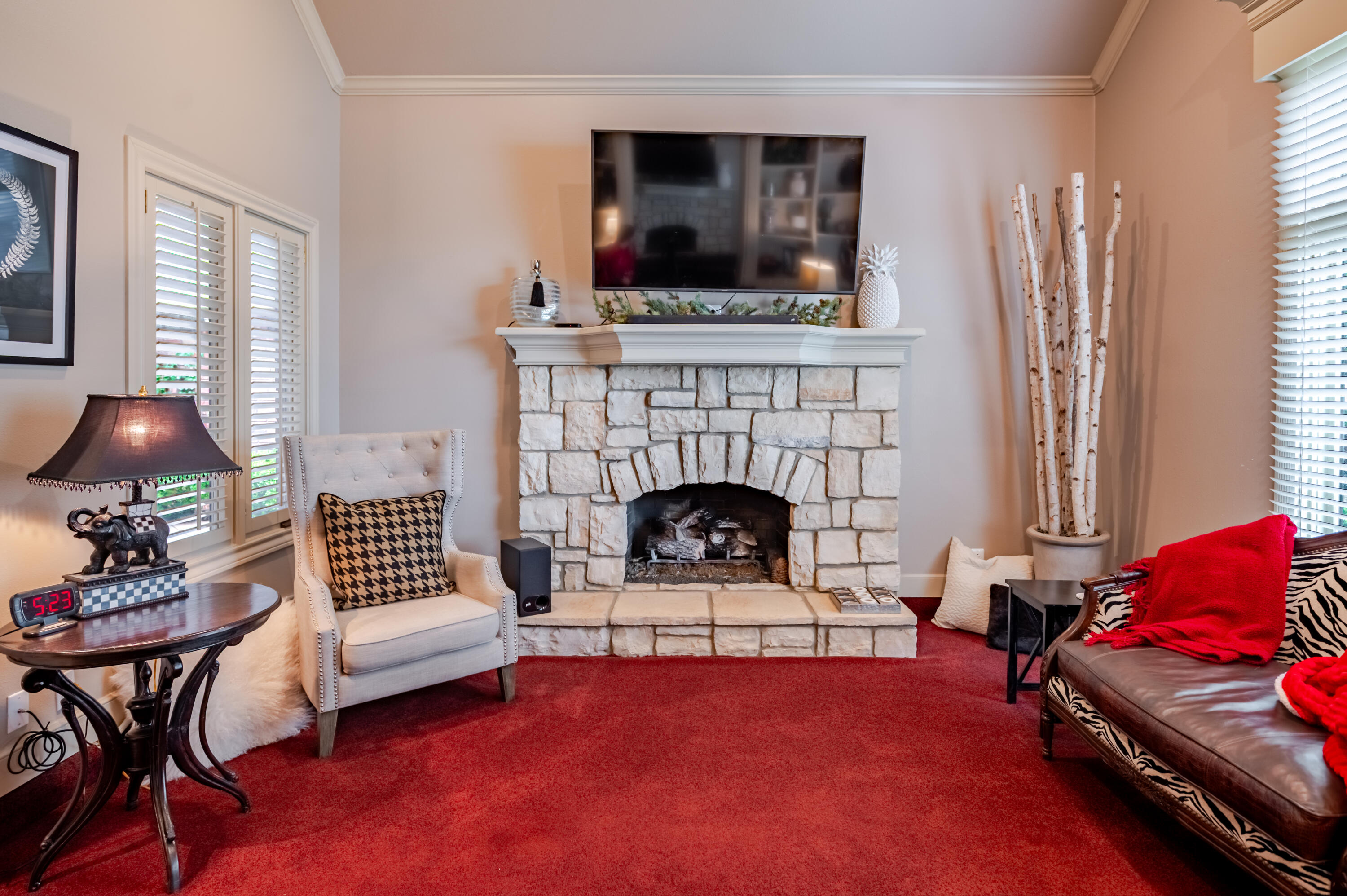 4226 97th Place Lubbock, TX 79423 - Photo 9 of 52 a living room with furniture and a fireplace