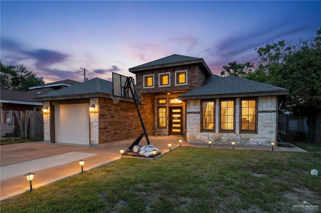 a view of a house with a swimming pool and a yard