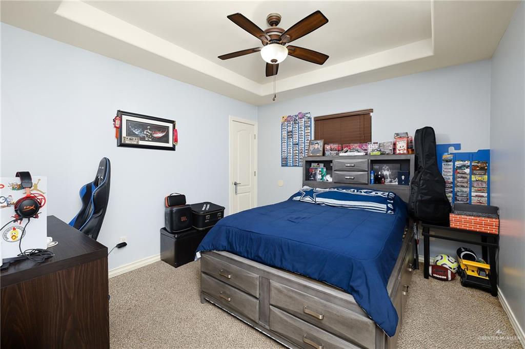 3609 Paseo Del Rey Edinburg, TX 78542 - Photo 12 of 20 a bedroom with a bed and a computer on a desk