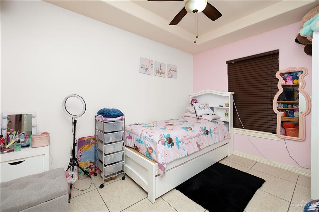 3609 Paseo Del Rey Edinburg, TX 78542 - Photo 14 of 20 a bedroom with a bed a dresser and chair