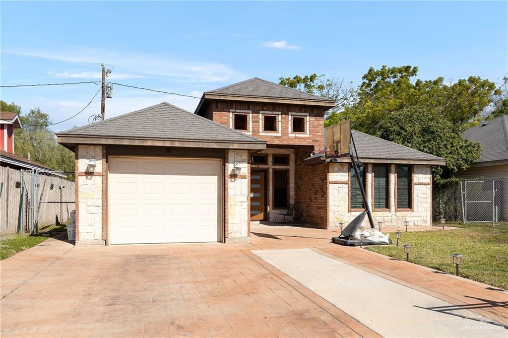 3609 Paseo Del Rey Edinburg, TX 78542 - Photo 3 of 20 a front view of a house with a garden