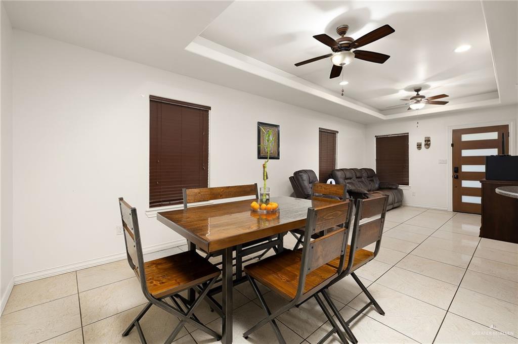 3609 Paseo Del Rey Edinburg, TX 78542 - Photo 5 of 20 a living room with furniture a ceiling fan a rug and a window