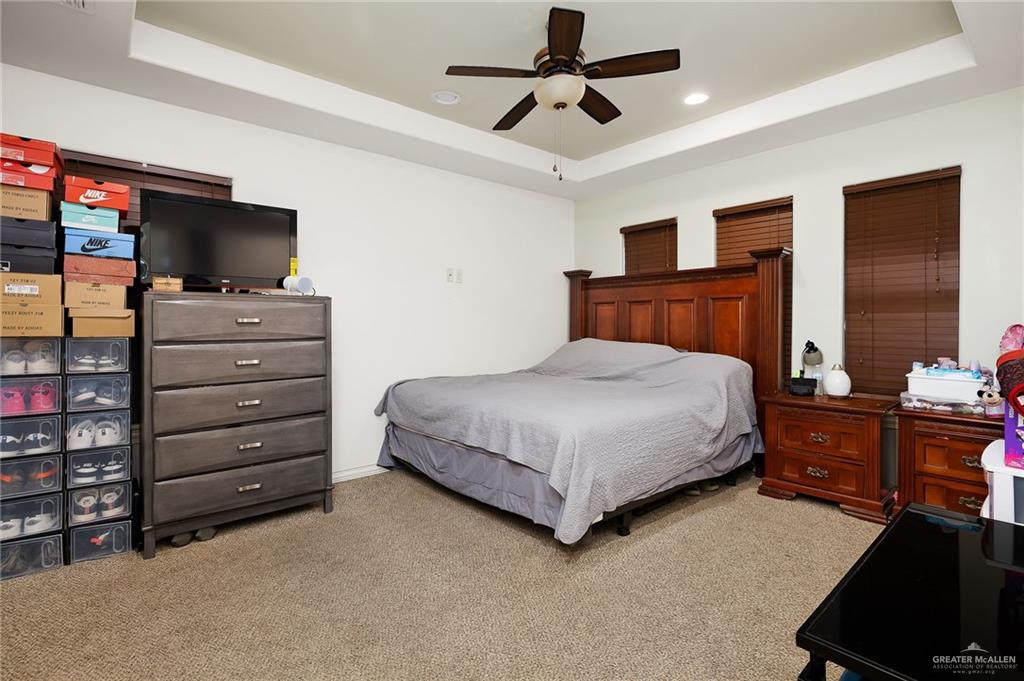 3609 Paseo Del Rey Edinburg, TX 78542 - Photo 10 of 20 a bedroom with a bed and a flat screen tv