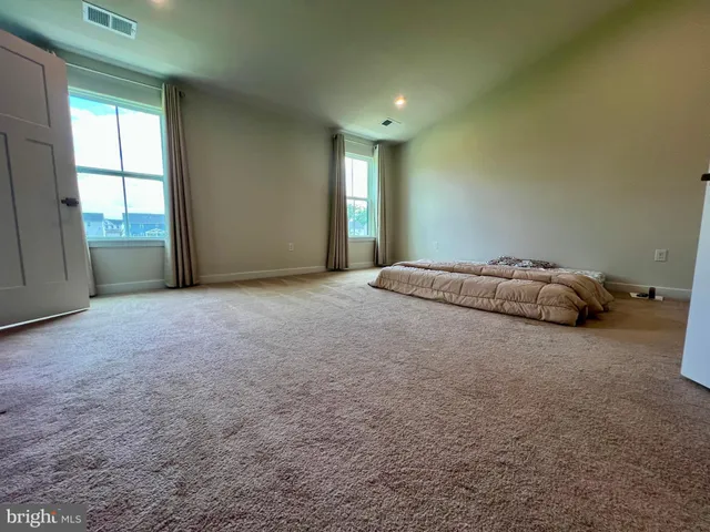a big room with windows and closet