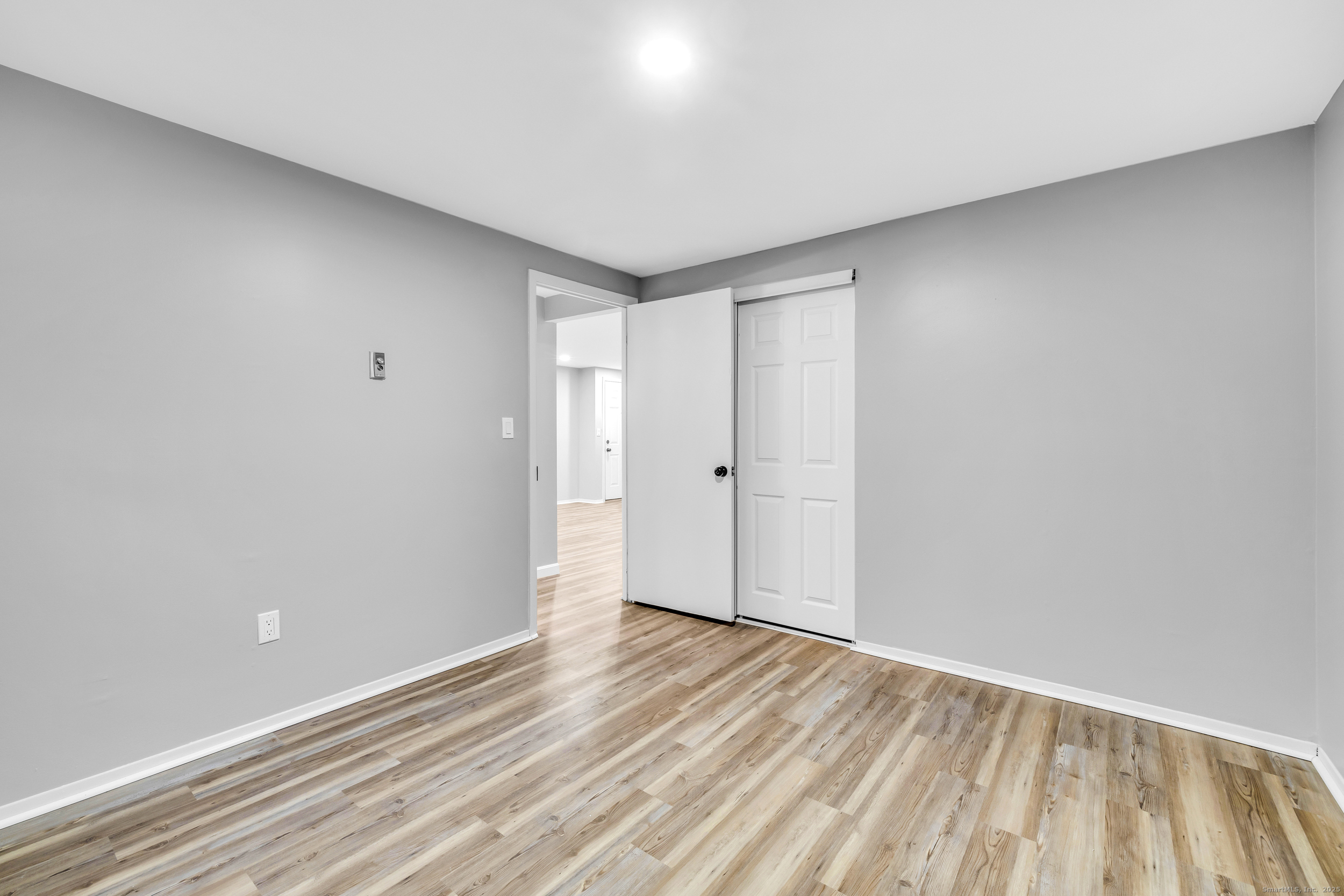 120 Gallup Hill Road, Unit 3C Ledyard, CT 06339 - Photo 12 of 14 a view of empty room with wooden floor