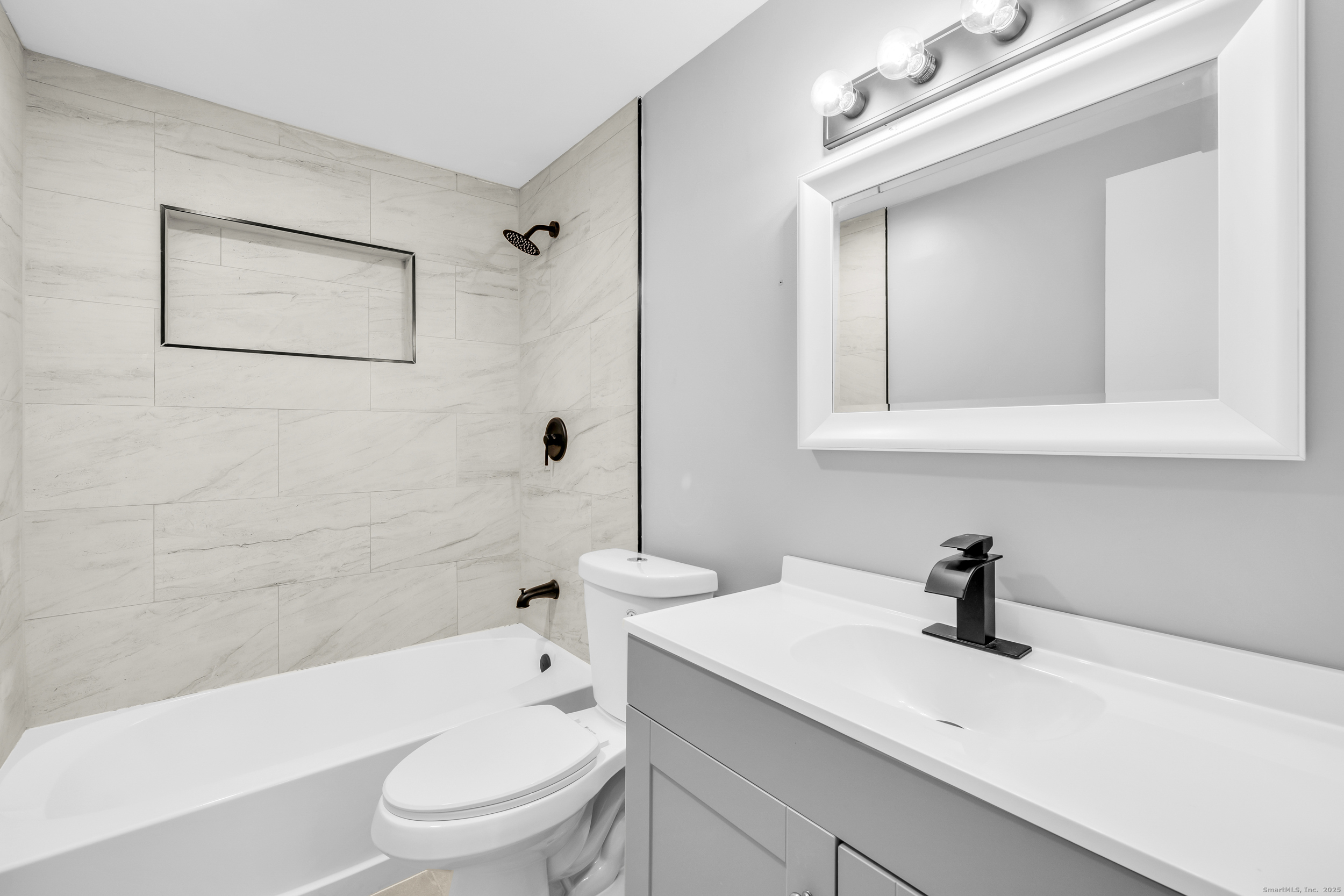 120 Gallup Hill Road, Unit 3C Ledyard, CT 06339 - Photo 4 of 14 a bathroom with a sink a toilet and shower