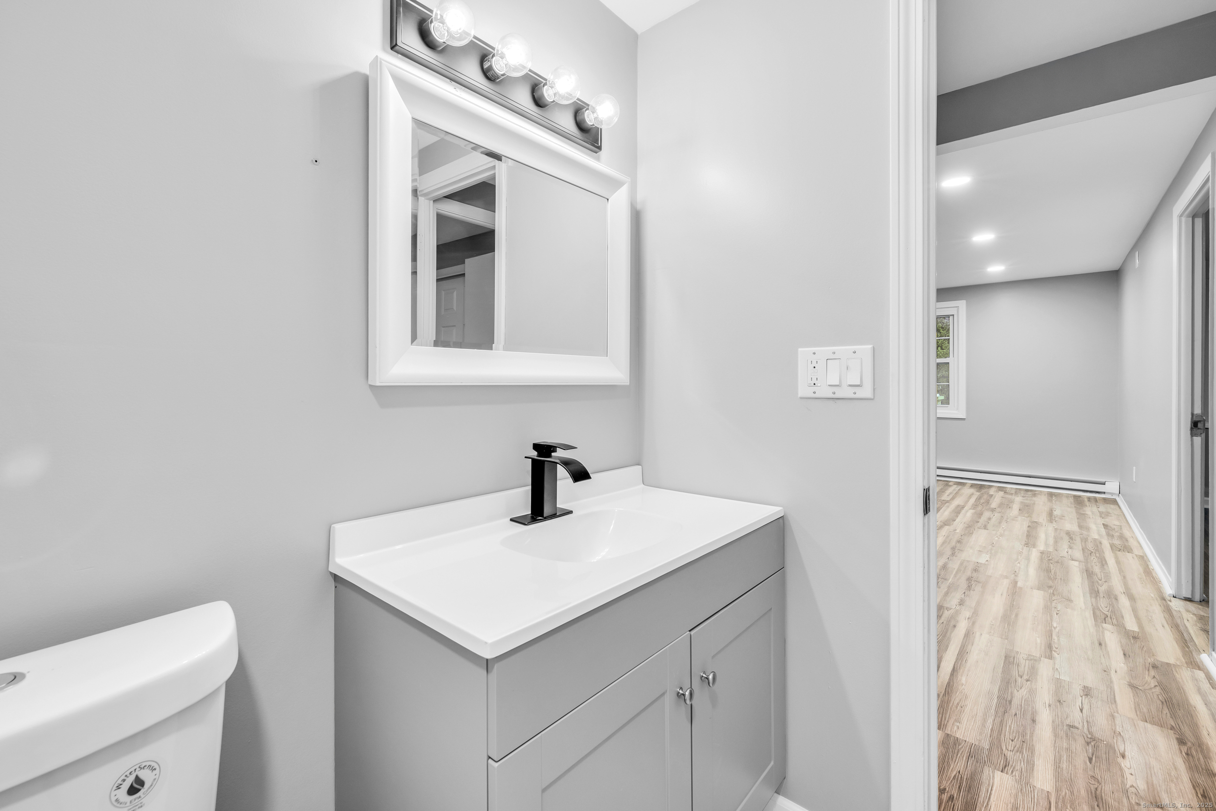 120 Gallup Hill Road, Unit 3C Ledyard, CT 06339 - Photo 5 of 14 a bathroom with a sink and a mirror