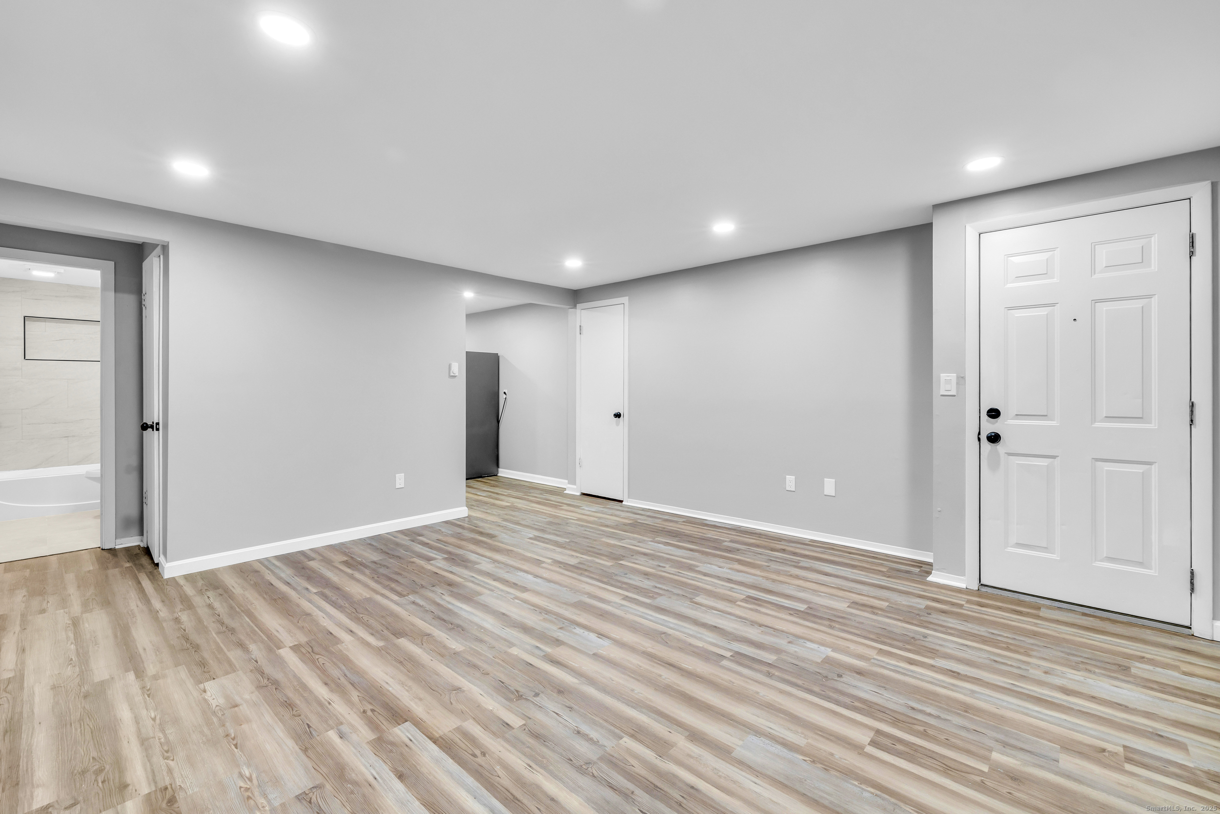 120 Gallup Hill Road, Unit 3C Ledyard, CT 06339 - Photo 8 of 14 a view of an empty room with wooden floor